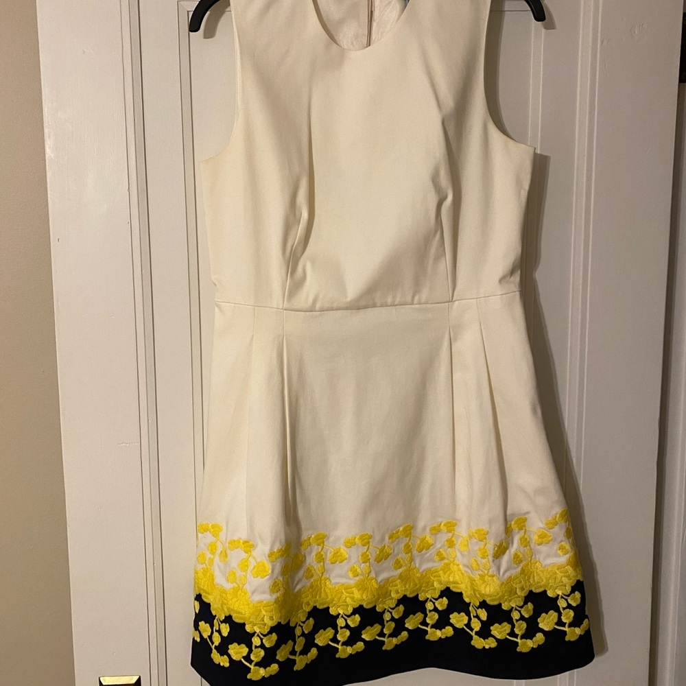 Beautiful white dress with detailing on bottom